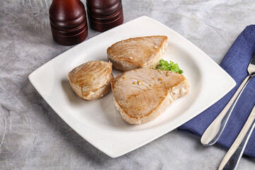 Roasted red tuna steak in the plate