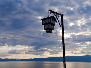 Traditional Ohrid house themed lantern at sunset.