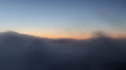 Long exposure shot of clouds moving at sunrise.