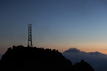 Silhouette of an antenna at sunrise.