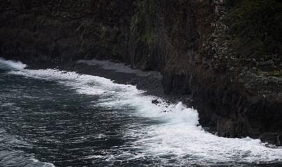 Water crashing against the cliffs of Madeira.