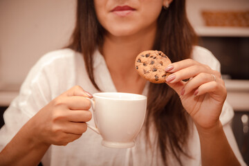 woman eats up problems with sweet chocolate cookies. eating disorder due to problems and stress