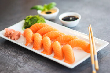 Fresh Sushi Roll with salmon.Japanese food. Copyspace black background.