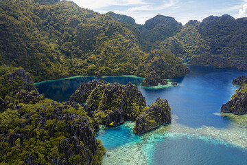 aerial drone photography of tropical island archipelago with jungle trees and blue water vacations