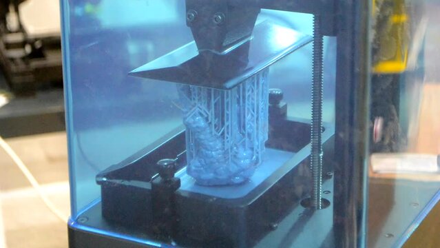 3D printer working process. 3D printing. Stereolithography photopolymerization SLA. Additive manufacturing technology. Liquid materials, hard part, creating layers. 3D model ultraviolet polymerization