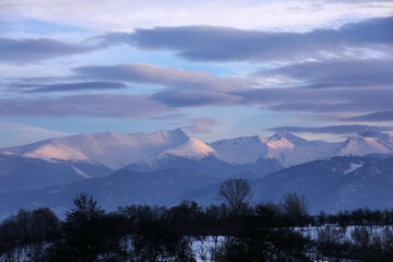 Winter alpine landscape in National Park Retezat, Carpathians, Romania, Europe. Snow covered moutains scenery