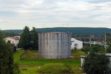 Fototapeta premium a tank for gasoline and oil near the railway tracks