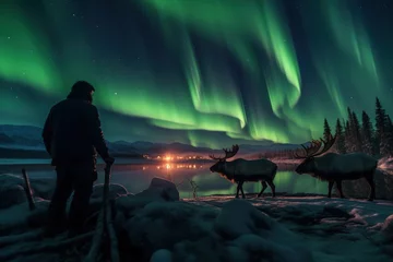Fotobehang A reindeer herder tending the herd under the northern lights  © fotogurmespb