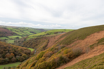 Fototapeta na wymiar Landscape photo of the autumn colours in the Doone valley in Exmoor National Park