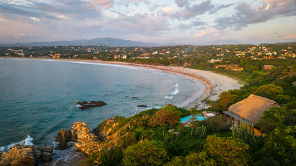 Aerial high angle of La punta Zicatela beach in Oaxaca Mexico Puerto Escondido at sunset