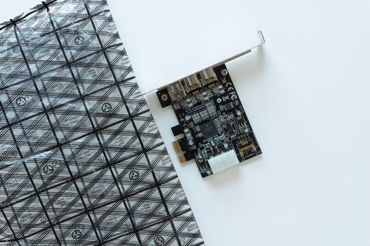 isolated pci-e expansion card (to firewire 400/800) with anti-static bag on paper