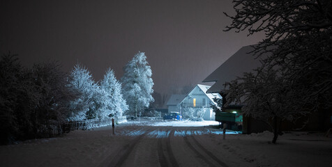 Snowy street at night in the light of a lantern, Europe - obrazy, fototapety, plakaty