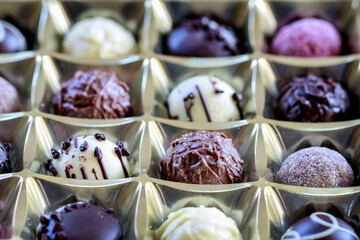 Box with various chocolate pralines.