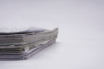 Background view of stacks of papers on white background
