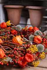 Floral arrangement with physalis, rosa canina and other autumn plants, panorama.
