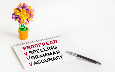 Proofread Spelling Grammar Accuracy phrase written on notepad