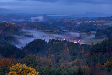 morning fog over the meadows in the mountain valley - dawn in the mountains, just before the rain
