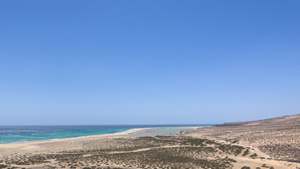 Fototapeta na wymiar As the tide comes in, the lagoon fills at Sotavento Beach, Fuerteventura