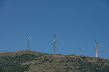 Wind turbines on a mountain top.