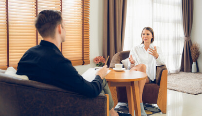 Psychological consultation gaining improvement on mental problem, happy young female patient doing therapy session while psychiatrist making diagnostic on mental illness. Unveiling - obrazy, fototapety, plakaty