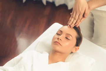 Deurstickers Caucasian woman enjoying relaxing anti-stress head massage and pampering facial beauty skin recreation leisure in dayspa modern light ambient at luxury resort or hotel spa salon. Quiescent © Summit Art Creations