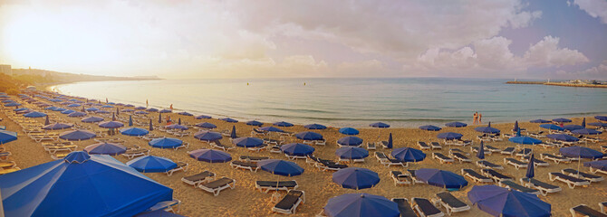 Panorama view of Pantachou Beach Glyki ,Nero Beach, Limanaki Beach and sea.Wonderful summer morning, blue beach umbrellas and sunbeds on sandy Beach in Ayia Napa, Cyprus.