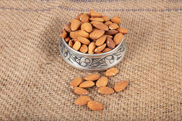 Peeled almonds close-up. For vegetarians. Large raw peeled almonds located on the background enjoying.