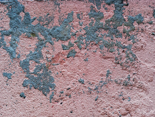 Weathered cement wall with flaking and peeling paint. Abstract grunge wall texture background. Aged concrete wall with copy space.