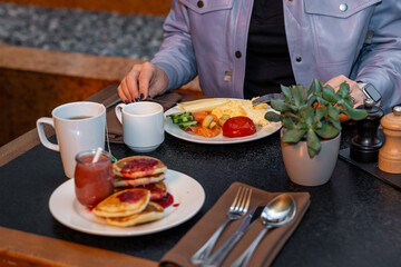 Relaxed Hotel Guest Savoring a Delicious Breakfast Spread