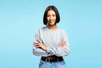  Portrait attractive Asian woman wearing stylish casual clothes with crossed arms looking at camera © speed300