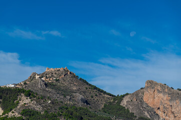 View of the fortified Andalusian village of Moclín on top of a mountain