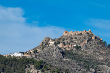 View of the fortified Andalusian village of Moclín on top of a mountain