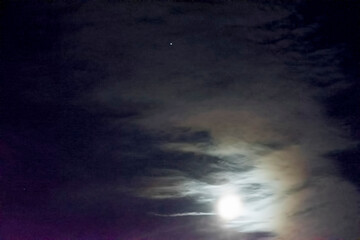 Venus and the moon and clouds , in the dark night