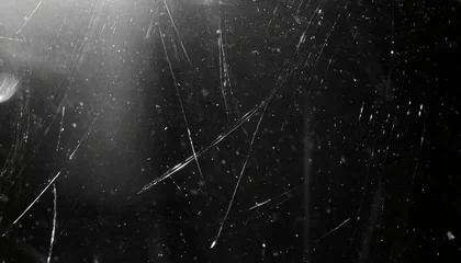 Fotobehang white dust and scratches on a black background the texture of dirt on the glass © Irene