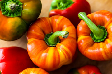 Colorful peppers on the wooden board