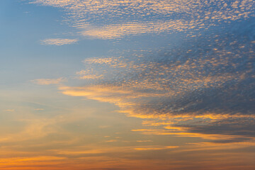 Background of colorful sky, Dramatic sunset with twilight color sky and clouds.