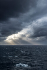 Fototapeta na wymiar Sun shining through Ocean Storm