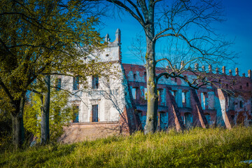 The ruins of Krupe Castle surrounded by a beautiful park.