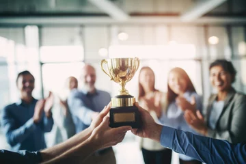 Tuinposter Business Team Celebrating Gold Trophy. Concept of success and achievement Office Team © fotoyou