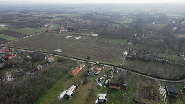 Aerial view of small houses in cloutryside in cloudy weather in Ub, Serbia