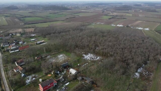 Light snow coverage around small houses in countryside of Ub, Serbia