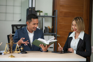 Partner lawyers or attorneys discussing a contract agreement. Successful businessmen have a contract in place to protect it,signing of modest agreements form in office