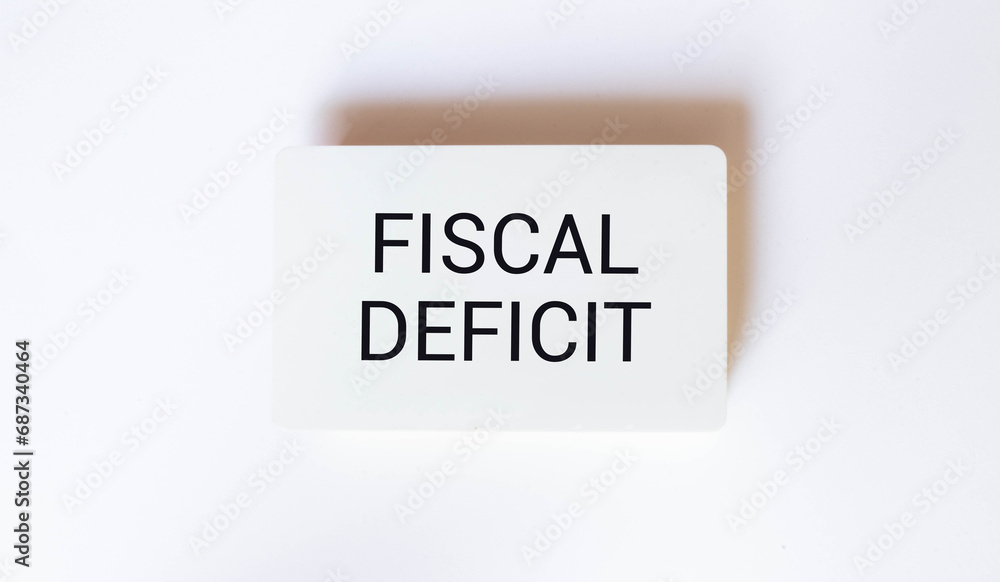Poster fiscal deficit text on sticker on notebook with magnifier and chart. business.