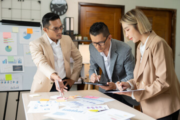 Asian businessmen, women and men Talk about new projects, presents at home office.