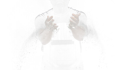 Chef prepare white flour dust for cooking bakery food. Elderly man Chef clap hand, white flour dust explode fly in air. Flour stop motion in air with freeze high speed shutter, black background