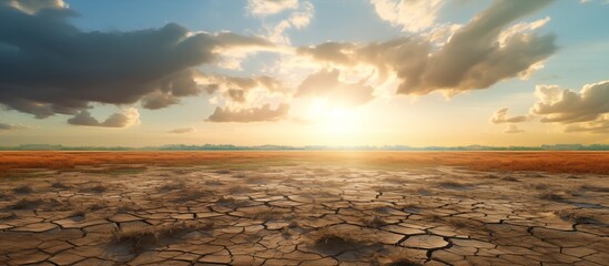 Dry cracked parched earth with sky blue and horizon. Global warming concept and climate change
