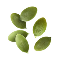 Peeled pumpkin seeds falling on white background