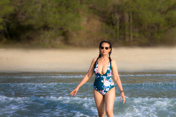 Woman body pretty with swimsuit relax at beach