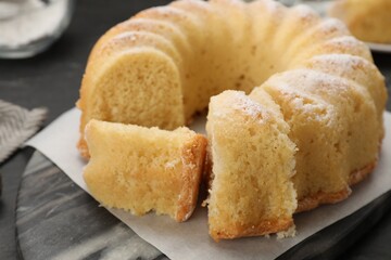 Delicious freshly baked sponge cake on table, closeup
