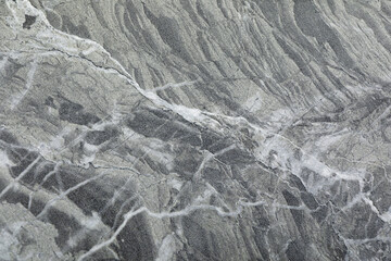 Texture of grey marble stone surface as background, closeup
